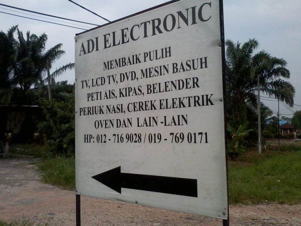 kedai elektrik membaiki peti ais